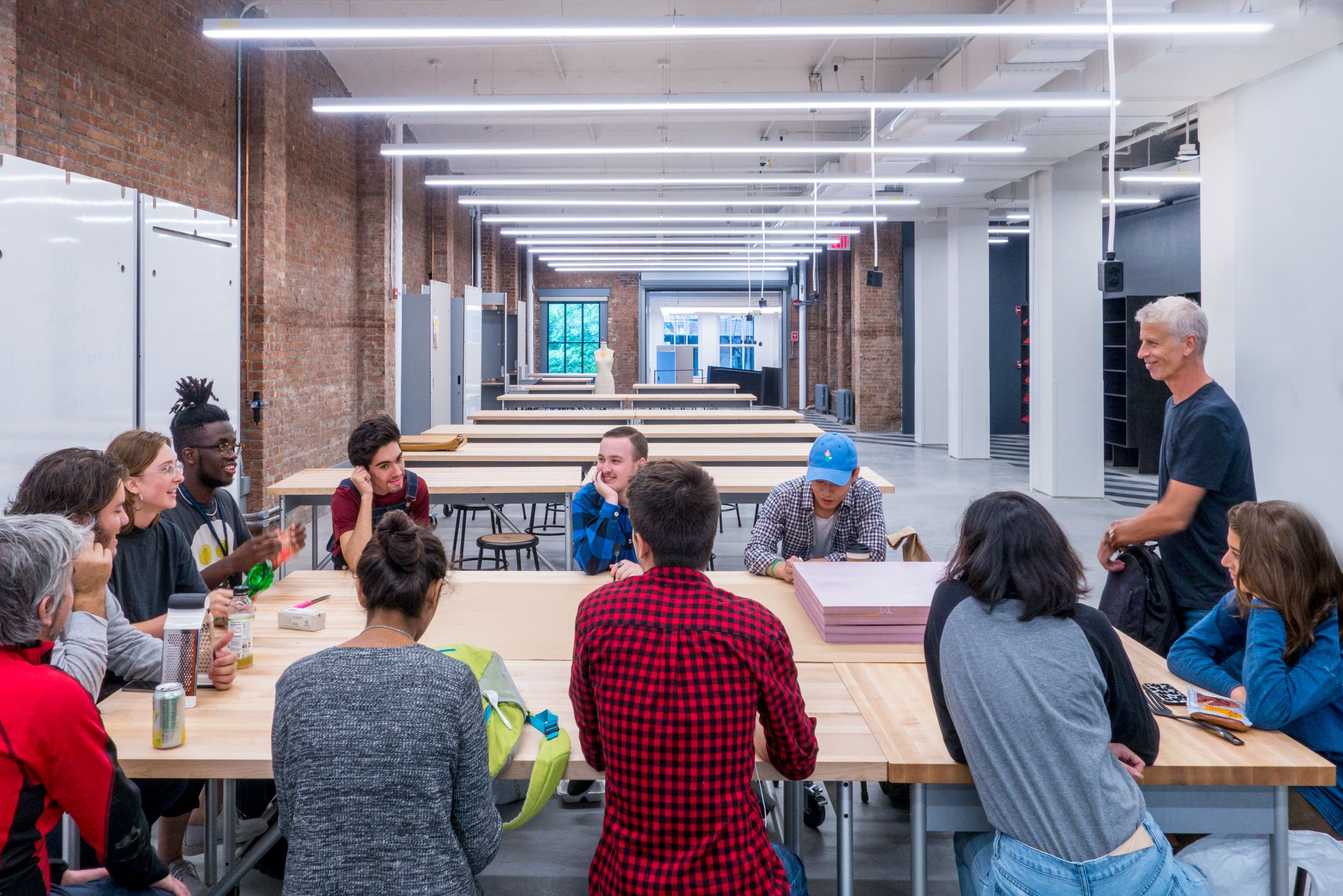 Parsons Making Center Butcher Block shop tables and large mobile storage partitions