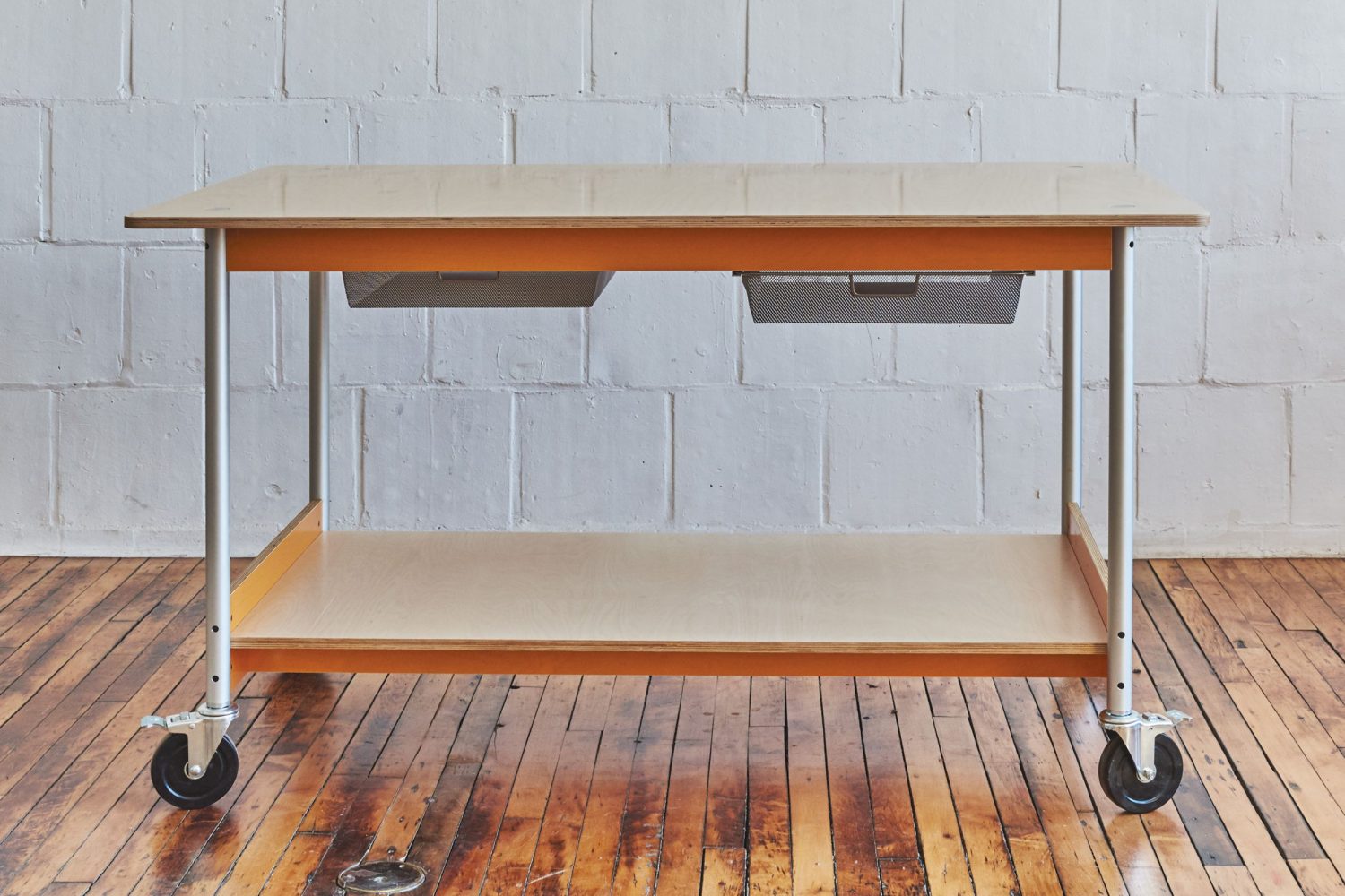 Platform Worktable with a generous work surface, and lower platform to store oversized items and boxes. Tops can be butcher block or birch.